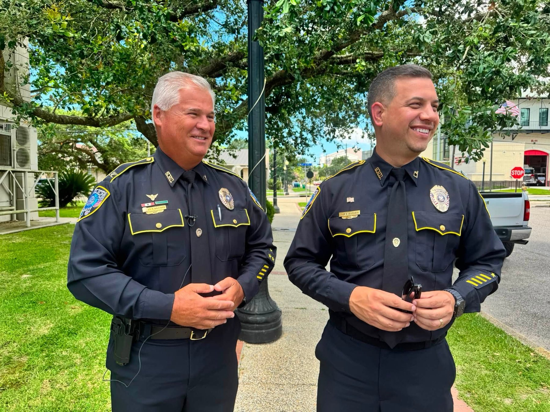 Daniel Seuzeneau in Slidell Police dress uniform, smiling beneath the oaks in Olde Towne Slidell